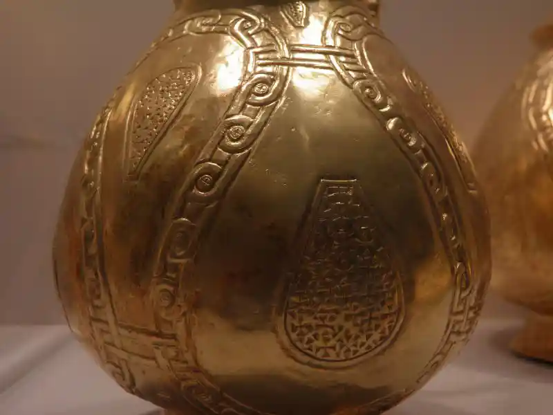 Gold vessel with a cross design